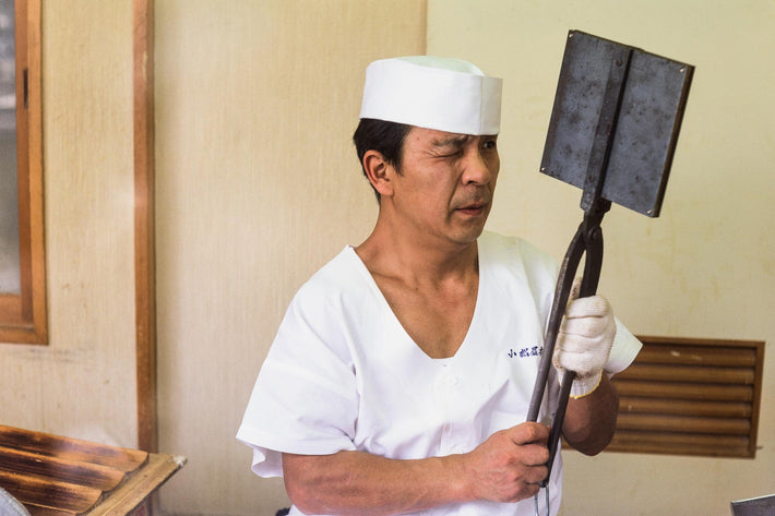 Chef in White Holding Press, Kamakura