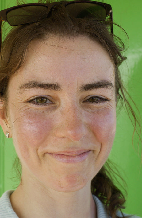 Smiling Young Woman Green Background, Siena